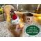 This image shows the Christmas elf, with his hat sitting next to him. A battery-operated candle is included in your purchase. 